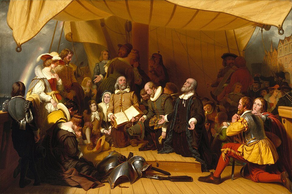 Oil painting of people in seventeenth century dress kneeling in prayer on a ship deck around an open book.